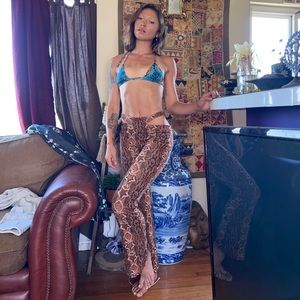 Urban Outfitters Snakeskin flare leggings in size small with cut outs on hips